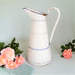Large, antique white enamel pitcher from Tiggy and Pip. 129€ with FREE worldwide shipping.