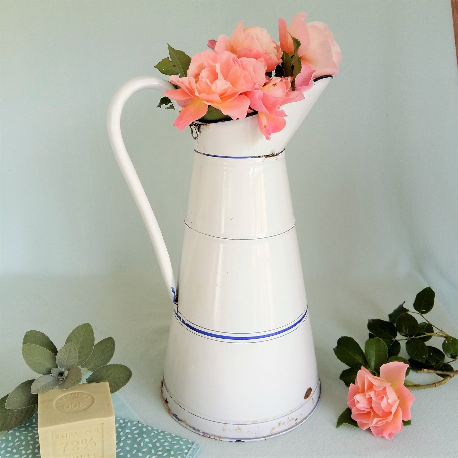 Large, antique white enamel pitcher from Tiggy and Pip. 129€ with FREE worldwide shipping.